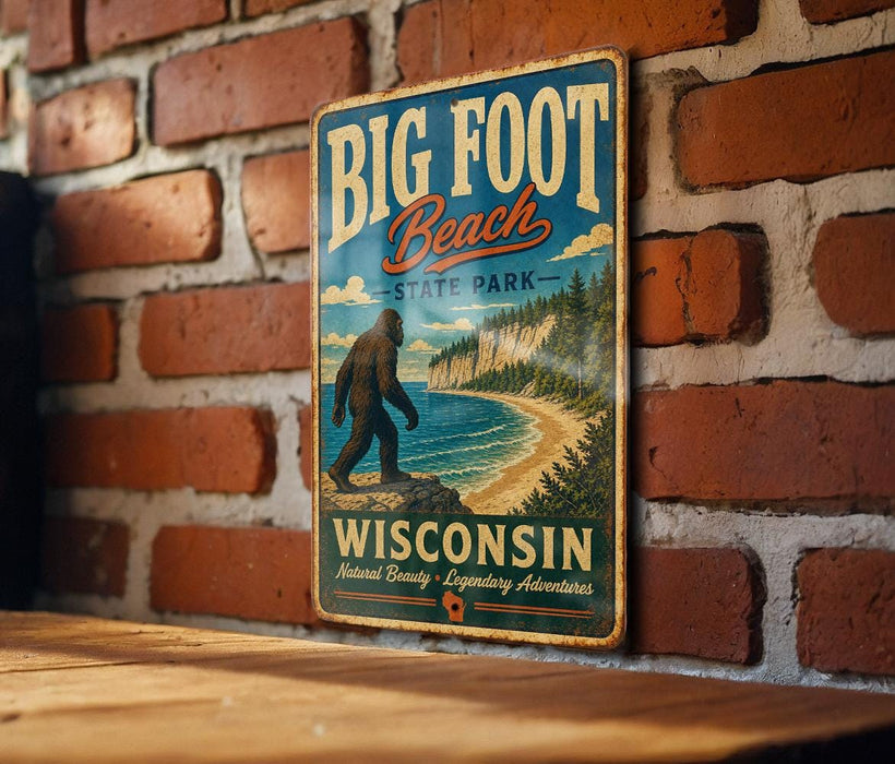 A vintage-style metal sign for Big Foot Beach State Park in Wisconsin, featuring a large Sasquatch figure and a scenic beach landscape.