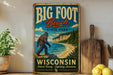 A vintage-style sign for Big Foot Beach State Park in Wisconsin, featuring a large Sasquatch figure and a scenic beach landscape.