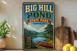A vintage-style sign for Big Hill Pond State Park in Tennessee, featuring a scenic image of a lake, forest, and canoe.