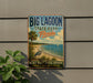 A vintage-style sign for Big Lagoon State Park in Florida, featuring a beach scene with a crane and palm trees, mounted on a wall.