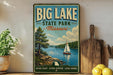 A vintage-style sign for Big Lake State Park in Missouri, featuring a sailboat on a lake surrounded by trees and mountains.