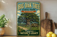 A vintage-style metal sign for Big Oak Tree State Park in Missouri, featuring a large oak tree and a wooden sign that reads "Preserve Nature's Legacy".