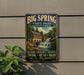 A vintage-style metal sign for Big Spring State Park in Pennsylvania, featuring a scenic image of a waterfall and a building.