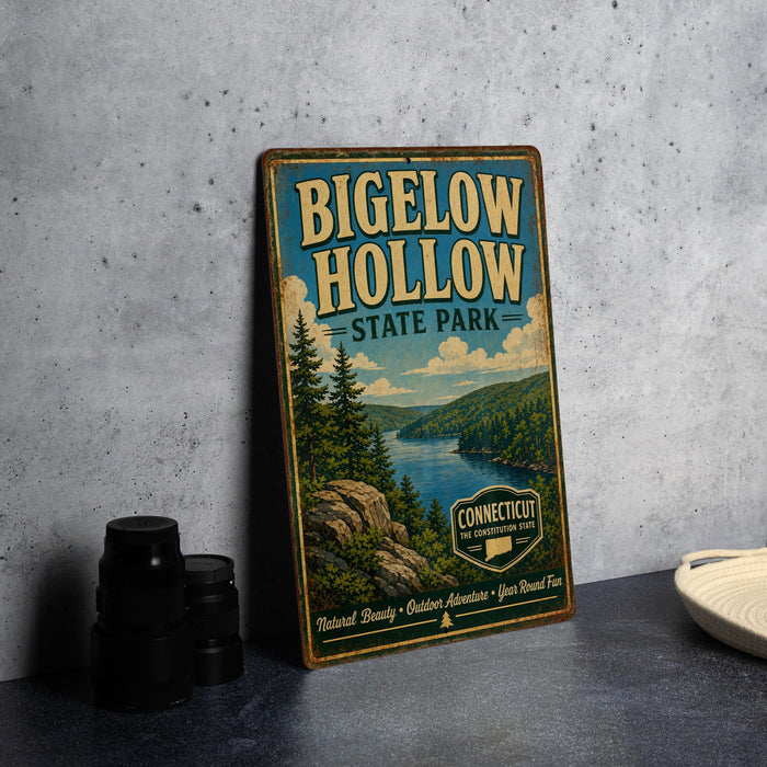 A vintage-style sign for Bigelow Hollow State Park, featuring a scenic landscape with pine trees, a lake, and mountains.