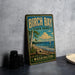 A vintage-style metal sign for Birch Bay State Park in Washington, featuring a scenic landscape with a sailboat on the water.