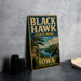 A vintage-style metal sign for Black Hawk State Park in Iowa, featuring a scenic landscape with a river, trees, and a bird in flight.