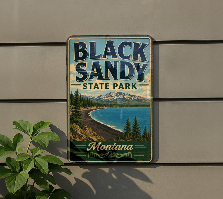 A vintage-style metal sign for Black Sandy State Park in Montana, featuring a scenic landscape with mountains, pine trees, and a lake.