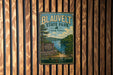 A vintage metal sign for Blauvelt State Park in New York, featuring a scenic landscape with a lake and mountains.