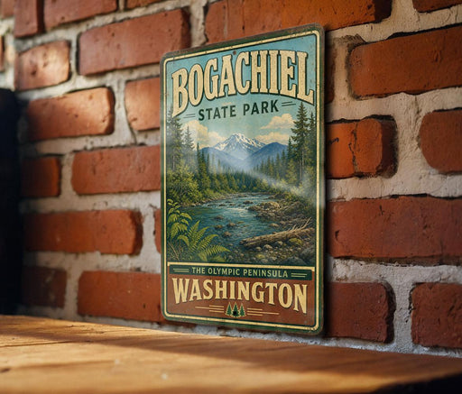A vintage-style sign for Bogachiel State Park in Washington, featuring a scenic mountain landscape with a river and pine trees.