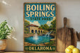 A vintage-style sign for Boiling Springs State Park in Oklahoma, featuring a scenic illustration of a pond with a waterfall and a building in the background.