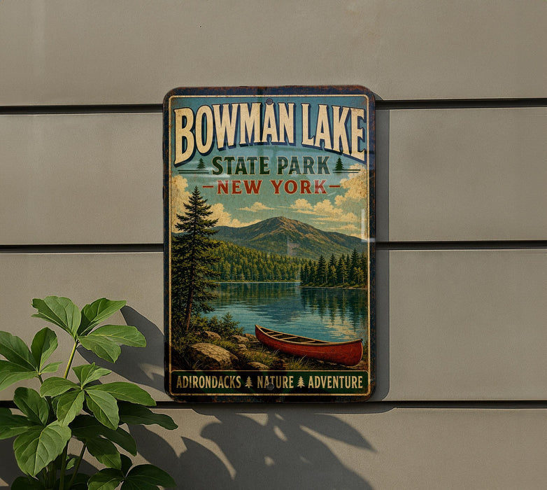 A vintage-style metal sign for Bowman Lake State Park in New York, featuring a scenic image of a lake, mountains, and a canoe.