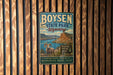 A vintage metal sign for Boysen State Park in Wyoming, featuring a scenic mountain landscape with a wind diver country backdrop.