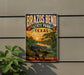 A vintage-style metal sign for Brazos Bend State Park in Texas, featuring an illustration of a crocodile in a pond with a sunset in the background.