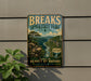 A vintage-style metal sign for Breaks Interstate Park in Virginia, featuring a scenic mountain landscape with a river and lush vegetation.