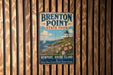 A vintage metal sign for "Brenton Point State Park" hanging on a wooden wall.