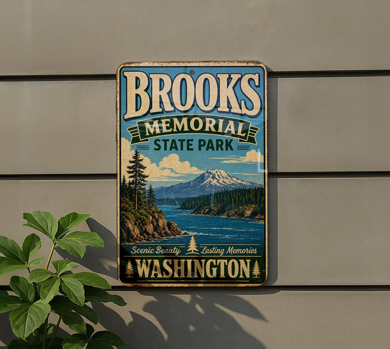 A vintage-style metal sign for Brooks Memorial State Park in Washington, featuring a scenic landscape with mountains, forests, and a lake.