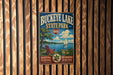 A vintage metal sign for Buckeye Lake State Park, featuring a scenic illustration of a lake, a sailboat, and a chair overlooking the water.