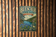 A vintage metal sign for Buescher State Park in Texas, featuring a scenic landscape with pine trees, a river, and blue flowers.