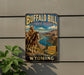 A vintage-style metal sign for Buffalo Bill State Park in Wyoming, featuring a cowboy on horseback and a scenic landscape.