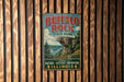 A vintage metal sign for Buffalo Rock State Park in Illinois, featuring a scenic landscape with a cliff and a lake.