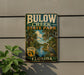 A vintage-style sign for Bulow Creek State Park in Florida, featuring a palm tree and a bird, mounted on a wall.