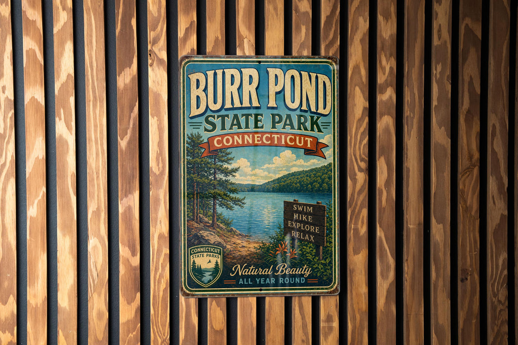 A vintage metal sign for Burr Pond State Park in Connecticut, featuring a scenic landscape with a lake and mountains.