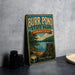 A vintage-style sign for the Burr Pond State Park in Connecticut, featuring a scenic image of the pond surrounded by trees and mountains.