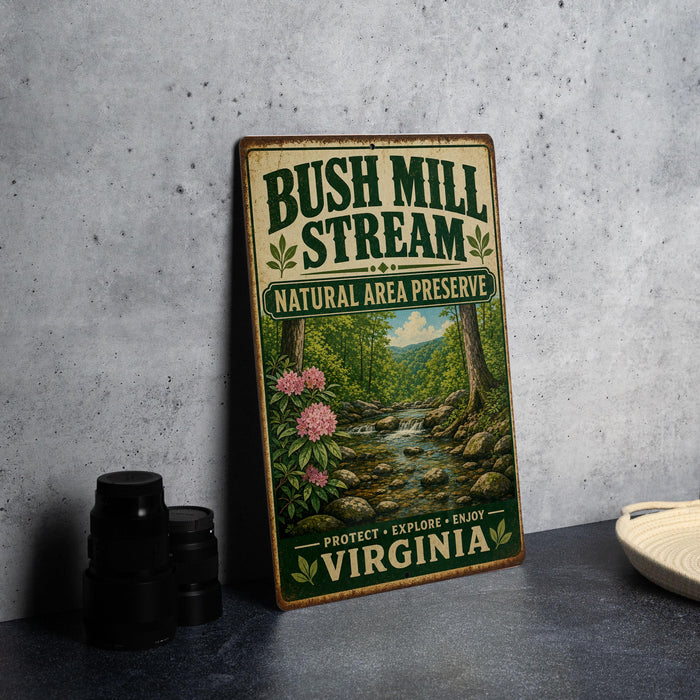 A vintage-style metal sign for Bush Mill Stream National Area Preserve in Virginia, featuring a scenic illustration of a stream surrounded by trees and flowers.