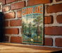 A vintage-style metal sign for Caddo Lake, Texas, featuring a scenic illustration of a lake with a canoe and a tree with hanging roots.