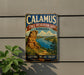 A vintage-style metal sign for Calamus State Recreation Area in Nebraska, featuring a scenic landscape with a river and mountains.