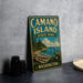 A vintage metal sign for Camano Island State Park in Washington, featuring a scenic landscape with a beach, mountains, and a sailboat.