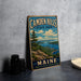 A vintage metal sign for Camden Hills State Park in Maine, featuring a scenic landscape with mountains, water, and a pine tree.