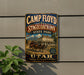 a vintage-style sign for the Camp Floyd Stagecoach Inn in Utah, with a horse-drawn carriage and a scenic mountain backdrop.