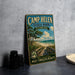 A vintage-style metal sign for Camp Helen State Park, Florida, featuring a beach scene with a wooden walkway leading to the beach.