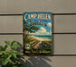 A vintage-style sign for Camp Helen State Park in Florida, featuring a beach scene with palm trees and a wooden walkway leading to the beach.