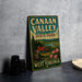 A vintage-style sign for Canaan Valley Resort State Park in West Virginia, featuring a scenic illustration of a cabin surrounded by nature.