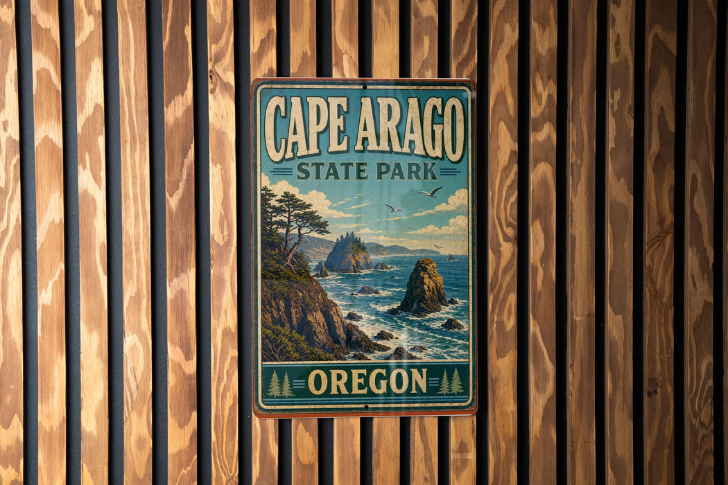 A vintage-style metal sign for Cape Arago State Park in Oregon, featuring a scenic landscape with mountains, trees, and the ocean.