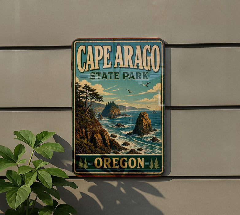 A vintage-style sign for Cape Arago State Park in Oregon, featuring a scenic landscape with mountains, cliffs, and the ocean.