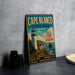 A vintage metal sign for Cape Blanco State Park in Oregon, featuring a lighthouse and coastal scenery.