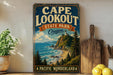 A vintage-style sign for Cape Lookout State Park in Oregon, featuring a scenic coastal landscape with a lighthouse and mountains in the background.