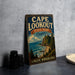 A vintage-style metal sign for Cape Lookout State Park in Oregon, featuring a scenic coastal landscape with a lighthouse and ocean.