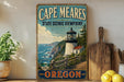 A vintage-style metal sign for Cape Meares State Scenic Viewpoint in Oregon, featuring a lighthouse and a coastal landscape.