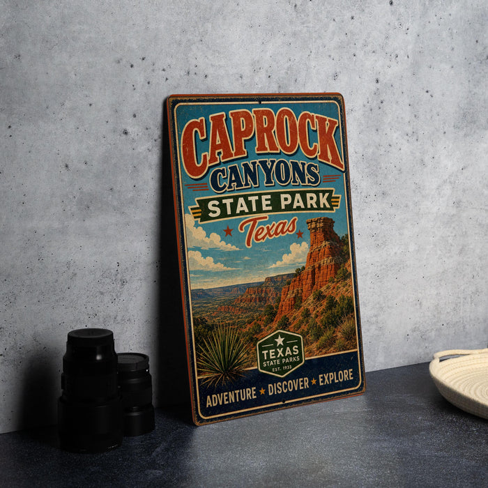 A vintage-style metal sign for Caprock Canyon State Park in Texas, featuring a desert landscape with a prominent rock formation.