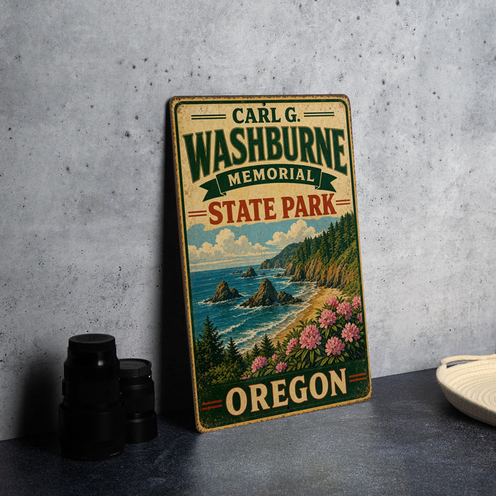 A vintage-style metal sign for Carl G. Washburne Memorial State Park in Oregon, featuring a scenic landscape with mountains, water, and flowers.