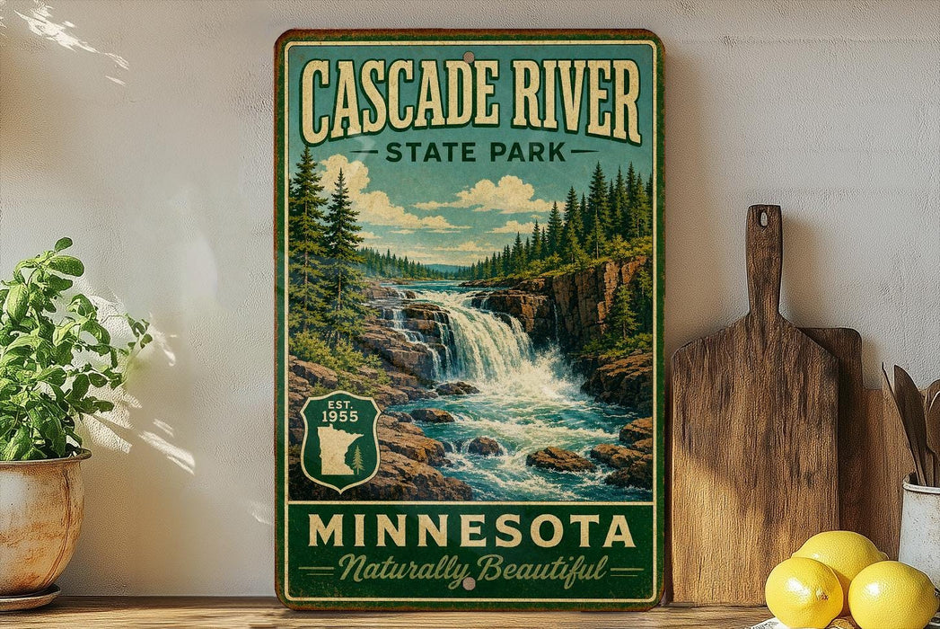 A vintage-style sign for Cascade River State Park in Minnesota, featuring a scenic image of a waterfall surrounded by pine trees.