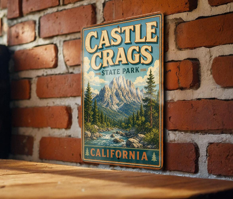 A vintage-style metal sign for Castle Crags State Park in California, featuring a mountain landscape and a river.