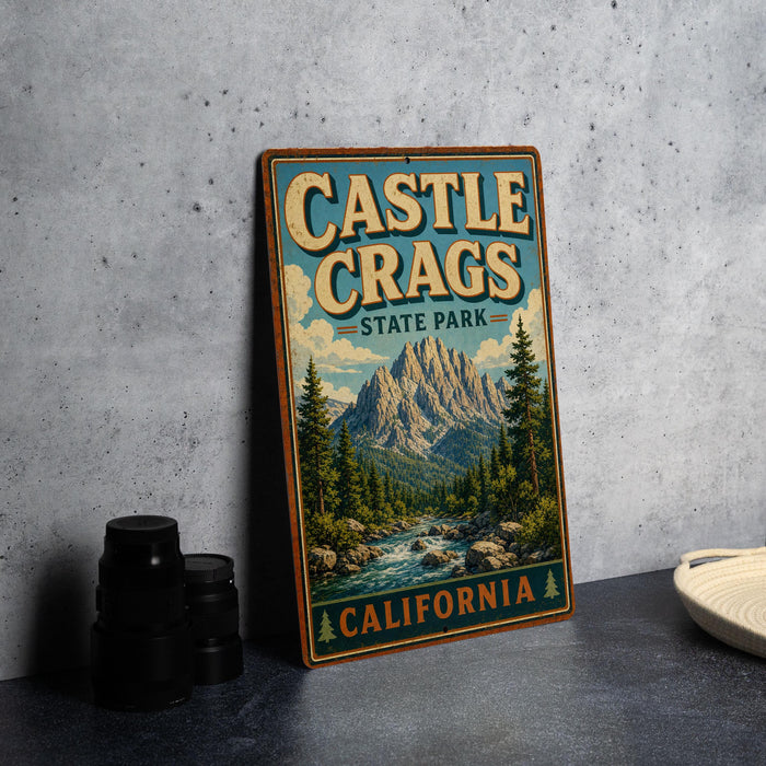 A vintage-style sign for Castle Crags State Park in California, featuring a mountain landscape and a river.