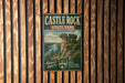 A vintage-style metal sign for Castle Rock State Park in Illinois, featuring a scenic illustration of a rock formation and a river.
