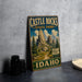 A vintage-style metal sign for Castle Rocks State Park in Idaho, featuring a scenic illustration of the park's landscape.