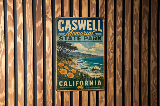 A vintage metal sign for Caswell Memorial State Park in California, featuring a scenic landscape with a beach, mountains, and trees.